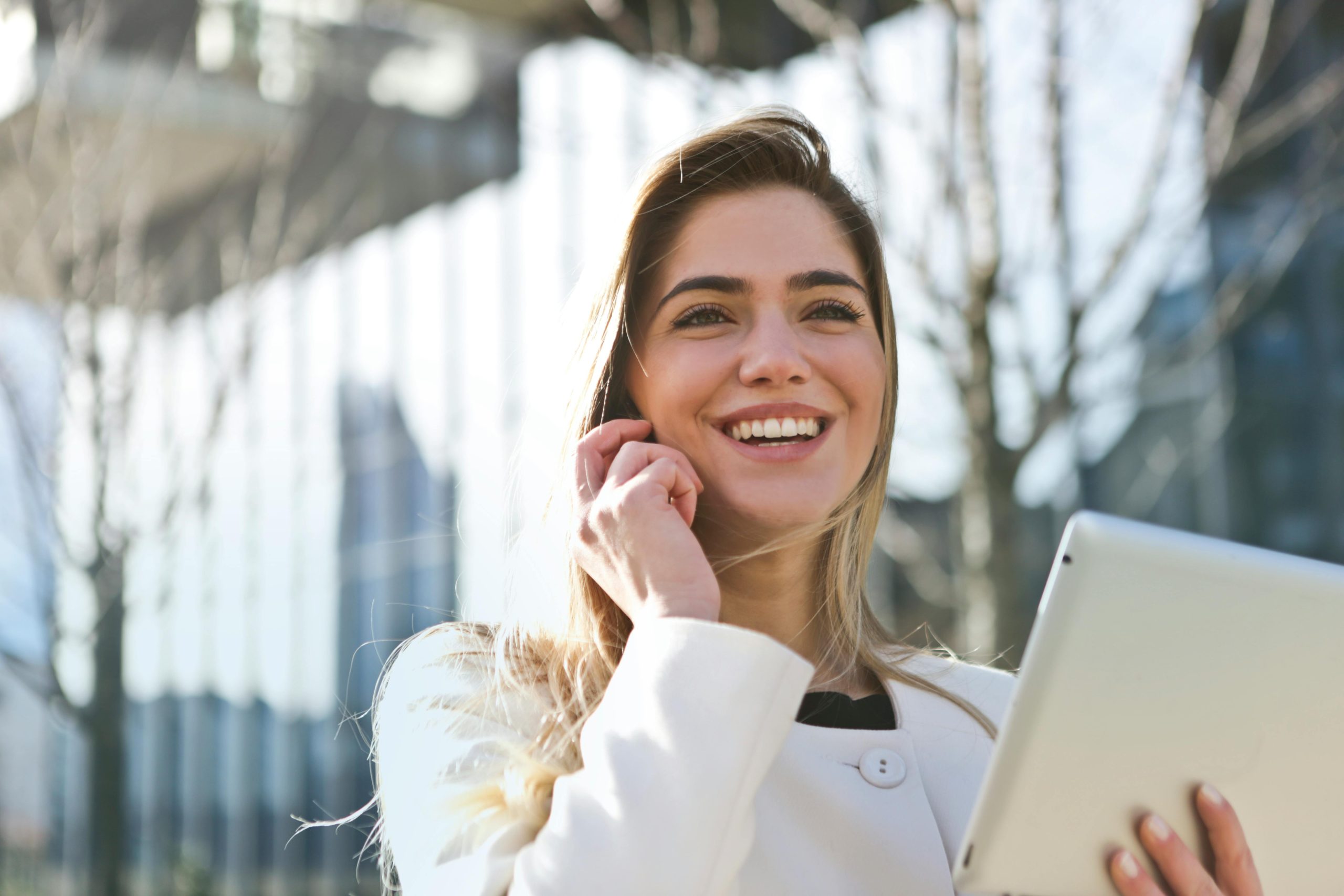 A woman on the phone asking her agent how much is the cost of starting a business.